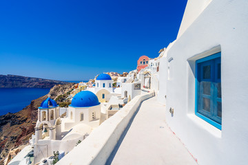 Fototapeta na wymiar Famous blue domes at Oia village,Santorini Island,Greece