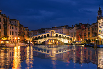 Rialto bridge and Garnd Canal at night in Venice, Italy