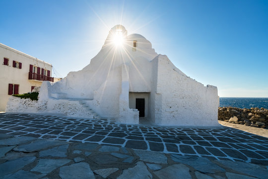 Paraportiani Church in Mykonos Town wit beautiful sun star, Cyclades, Greece