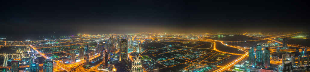 Fototapeta premium Aerial panorama of Dubai city at night 