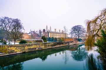 Fototapeta na wymiar View of Cam river and the ornamented facade of Clare College at sunrise in Cambridge, UK