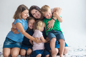 Mother and her 4  kids on white background