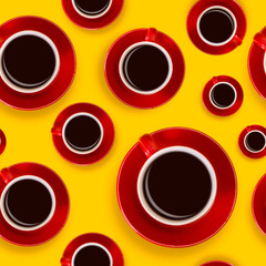 Seamless pattern with red coffee cups and a saucer on a yellow background. View from above