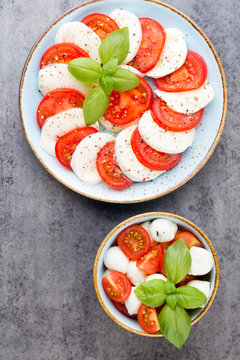 Classic caprese salad. Mozzarella tomatoes and  Basilikum.