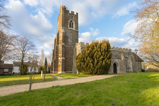 Church of St Mary the Virgin (St Mary's Church) with beautiful sky during golden hour in Harlington, England 