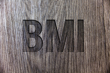 Conceptual hand writing showing Bmi. Business photo showcasing Body Mass Index determines healthy weight range with respect to height Wooden background vintage wood board message ideas feelings.