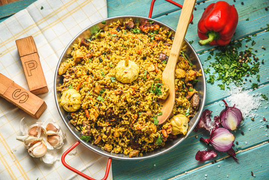 Pilaf with chicken.Chicken,rice,onion,carrots,vegetable oil.Ready pilaf mix,lay on the lagans,spread on top of rice chicken.Uzbek national dish.