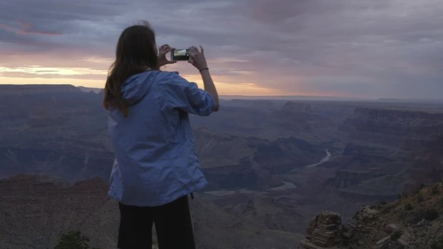 grand canyon sunset with young woman.