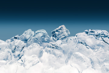 Pieces of crushed ice cubes on blue background. Clipping path included