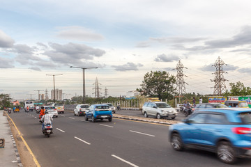 Electricity power substation in chennai india, where electrical power is generated, transmitted, and distributed to systems. Photographed during sunset with low lighting conditions, dark clouds in sky