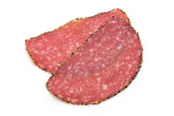 Salami slices isolated on the white background.