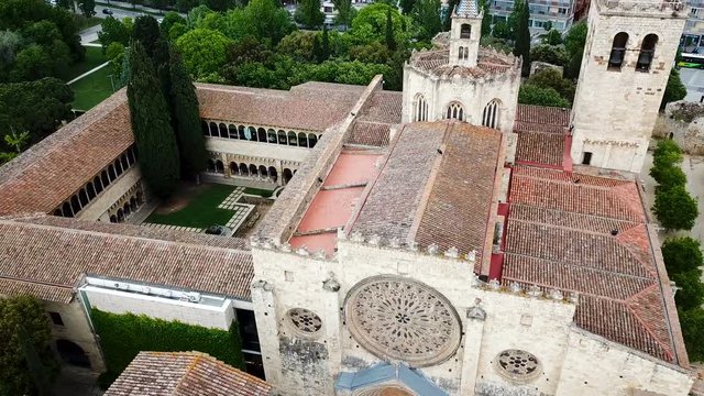 View from drone of ancient Benedictine abbey in Sant Cugat del Valles, Catalonia, Spain