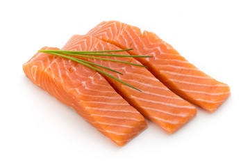 Fresh salmon fillet with basil on the white background.