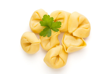 Raw homemade pasta,tortellini with herbs.