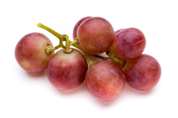 Ripe red grape isolated on white.