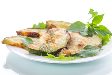 Fried zucchini in a white plate