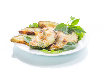Fried zucchini in a white plate
