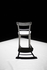 Chair in stage light, shadow