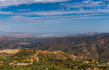 Fototapeta premium beautiful view of the mountains in the region of Andalusia, houses and farmland on the slopes of mountains