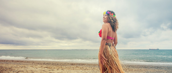 Hawaiian young woman portrait walking on the beach, letterbox