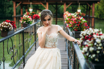 Fototapeta na wymiar Girl in wedding dress. Beautiful girl in garden