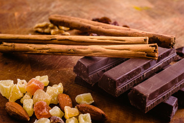 Plate of black chocolate chips with cinnamon and hazelnuts