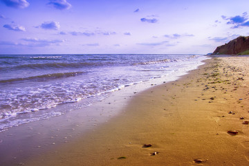 yellow sand beach near the blue beautiful sea
