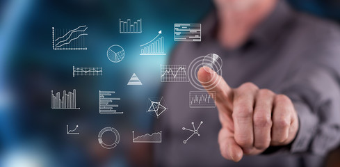 Man touching business charts