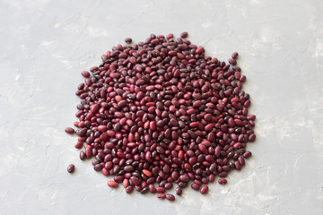 Heap of red beans on a gray stone background