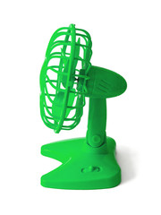 Green plastic fan with batteries, propeller and protective grille. Side view. Isolated on white background
