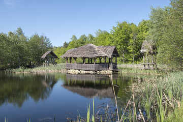 Fototapeta na wymiar hut on stilts on the water