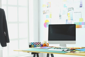 Empty workroom and workplace of tailor or vendor of clothes in small boutique