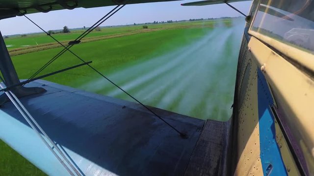 Agricultural Aviation. Agricultural Aircraft Sprays Chemicals Rice Field