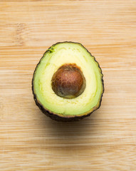 avocados cut in half on board
