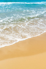 Fototapeta na wymiar Wave on the sand beach