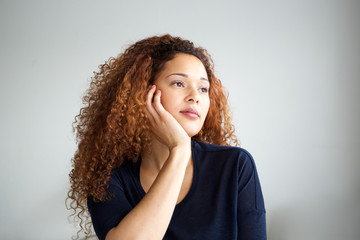 Close up young african american woman thinking and looking away