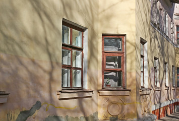 The wall of the old two-storey house with Bay Windows