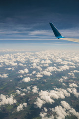 Aerial view of sky from aircraft window.