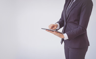 Young businesswoman using tablet