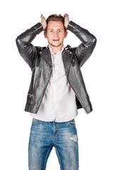 portrait of young man in black eather jacket isolated on a white background. Emotion and people concept.