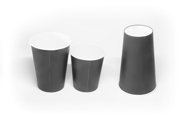 three paper cup on a light background