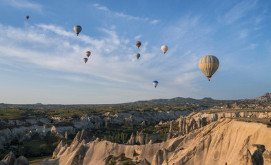 Fototapeta na wymiar The great tourist attraction of Cappadocia - balloon flight. Cappadocia is known around the world as one of the best places to fly with hot air balloons.
