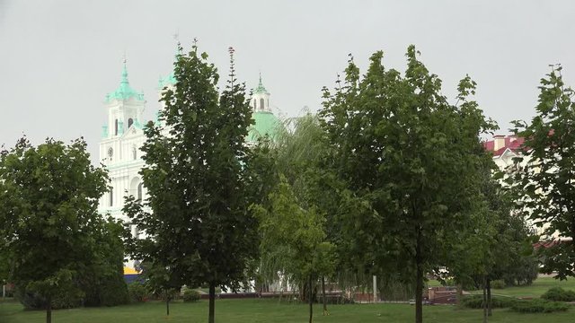 Strong rain in the public park of Soviet square. Grodno, Belarus