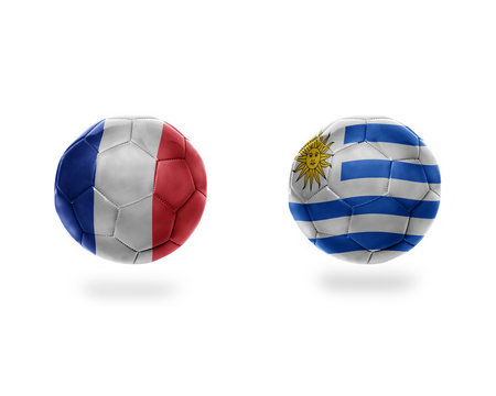 football balls with national flags of uruguay and france.