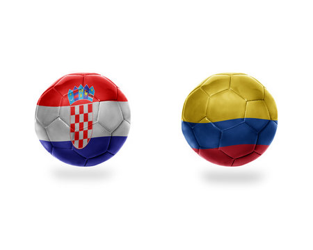 football balls with national flags of colombia and croatia.