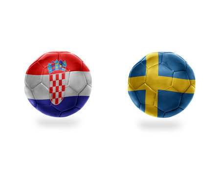 football balls with national flags of sweden and croatia.
