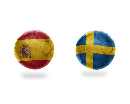 football balls with national flags of sweden and spain.