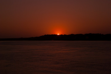 Fototapeta na wymiar Red sunset on the river