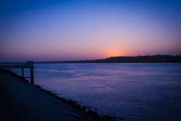 Fototapeta na wymiar Blue sunset over the river