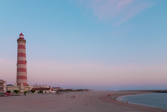 Lighthouse and beach at dusk